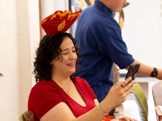 A tree ring Fairy engages with visitors